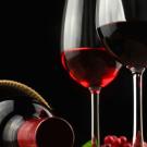 bottle on its side and wine in glasses