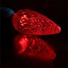 Photo: red Christmas light LED bulb and reflection