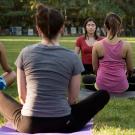 Woman leading yoga class at UC Davis.