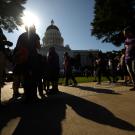 Protesters in shadows at California capitol building in Sacramento