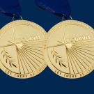 2 UC Davis Medals (gold) on UC Davis blue background