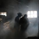 Men in smoke-filled room