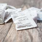 Silican gel packets on wood surface