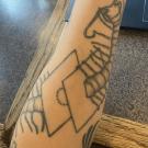 Centipede tattoo on forearm