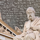 Plato in front of building, which are both in front of a math-filled background.