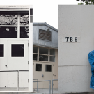 side by side images: on the left is Robert Arneson in a historical pose in front of TB 9; on the right is a UC Davis student assuming a similar pose