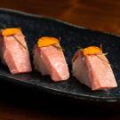 Three nigiri pieces of bluefin tuna toro made from cultivated protein. (BlueNalu)