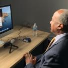 Chancellor Gary S. May interviews student via video chat.