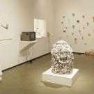 Winning exhibit features white-themed sculptures and wall art, including large white sphere in middle