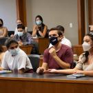 Students in masks in law school courtroom