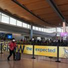 Outgrow the Expected ads on airport walls