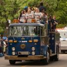 Basketball teams ride on top of antique fire engine in Picnic Day parade.