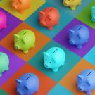 Piggy banks of multiple different colors.