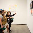 Students look at art at museum