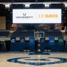 Videoboard hangs in The Pavilion, which will become the University Credit Union Center on july 1, showing the credit union logo and UC Davis wordmark.