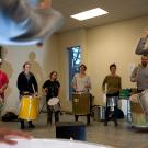 Samba class with several drummers in a circle