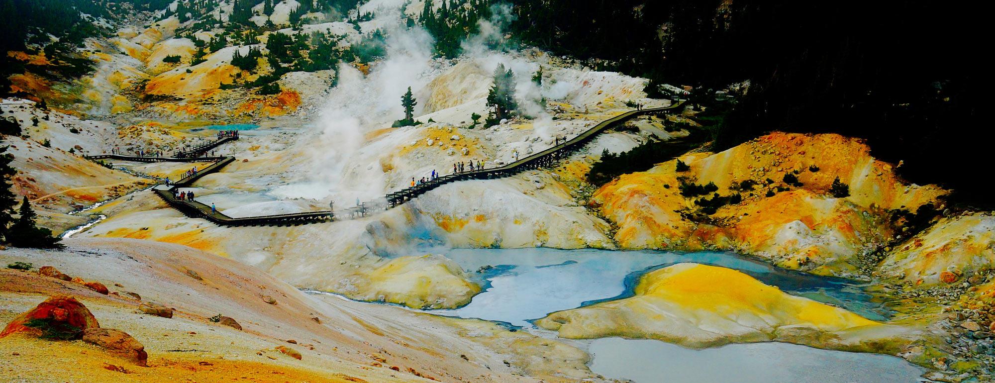 A crowd walking through a geothermal area in Lassen Volcanic National Park