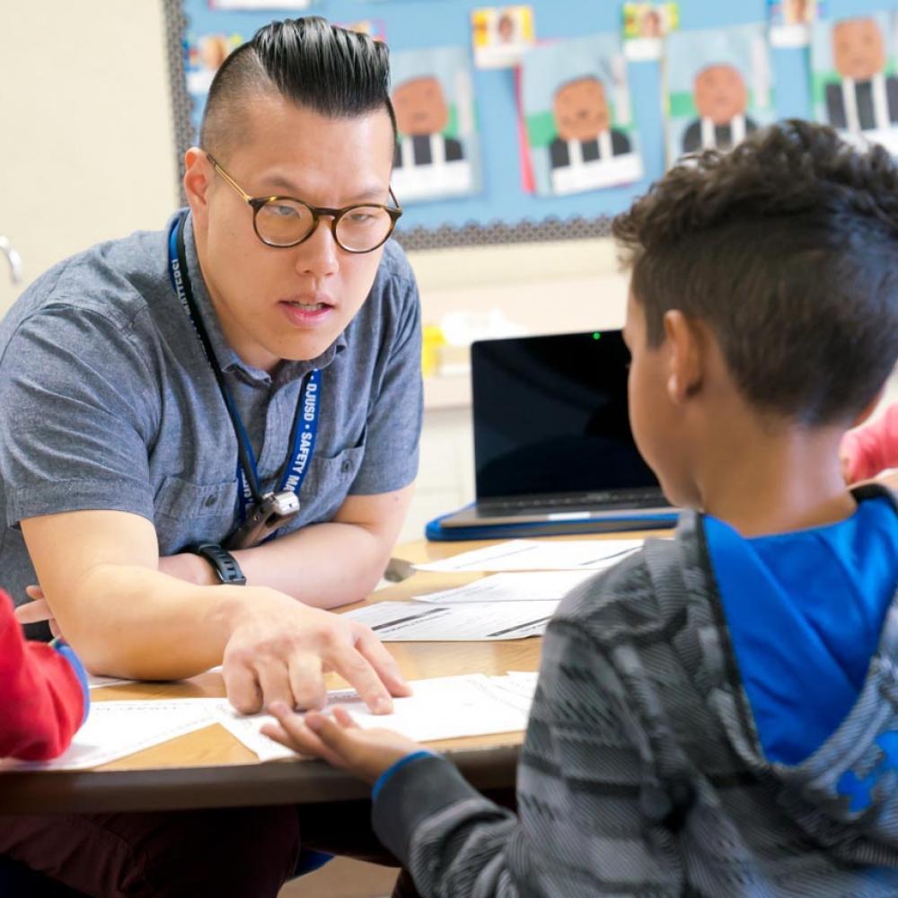 A student teacher with a child in a classroom at UC Davis