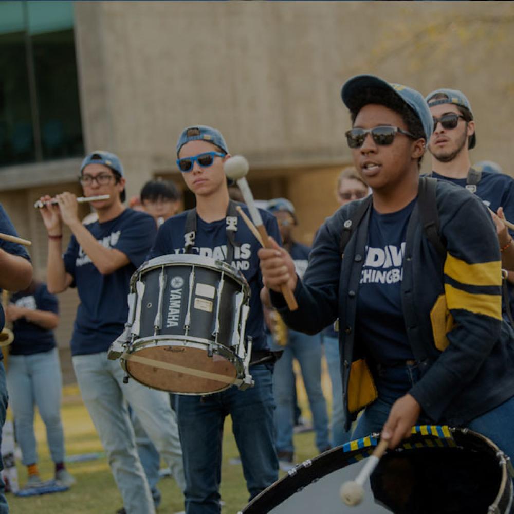 The UC Davis marching band plays outside of Hickey Gym
