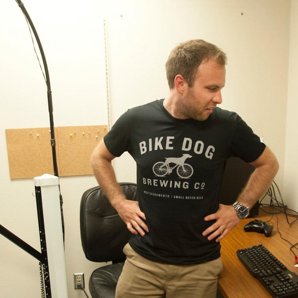 A test subject uses a haptic treadmill will a researcher observes his virtual actions