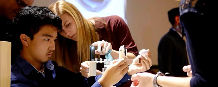 Two students test their device for medical exams