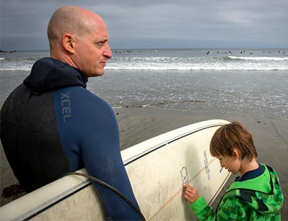 Surfing surgeon Boaz Arzi and his son, Jonathan, at the beach