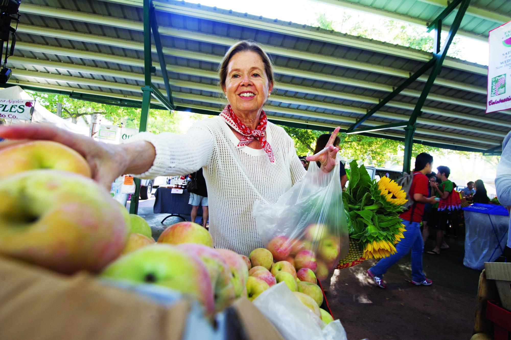 Ann Evans shops the Davis Farmers Market