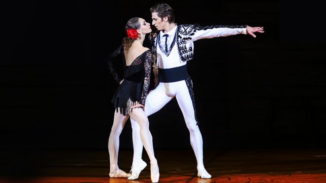 Two Bolshoi dancers on stage performing a scene from the Carmen Suite.