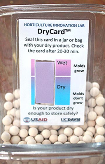 A small card in a glass jar displays a moisture-scale bar