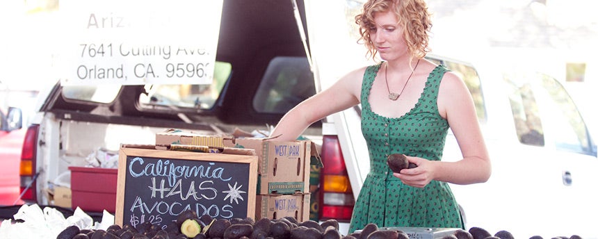 Woman selling avocados