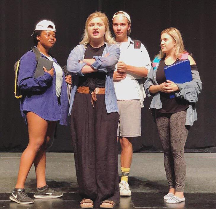 Members of the ensemble rehearsing a scene from "Ranked, A New Musical."
