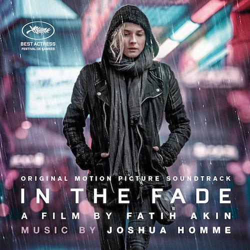 A promotional poster for the movie showing Katja standing in the rain wearing a hooded raincoat.