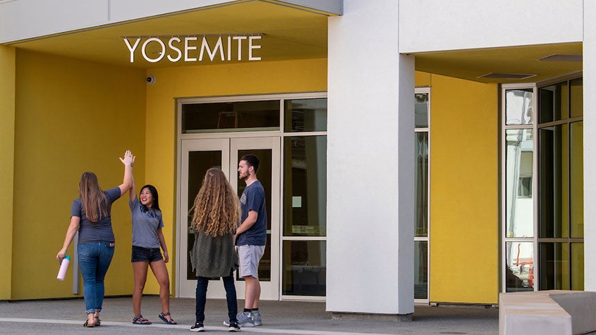 Four students outside Yosemite Hall