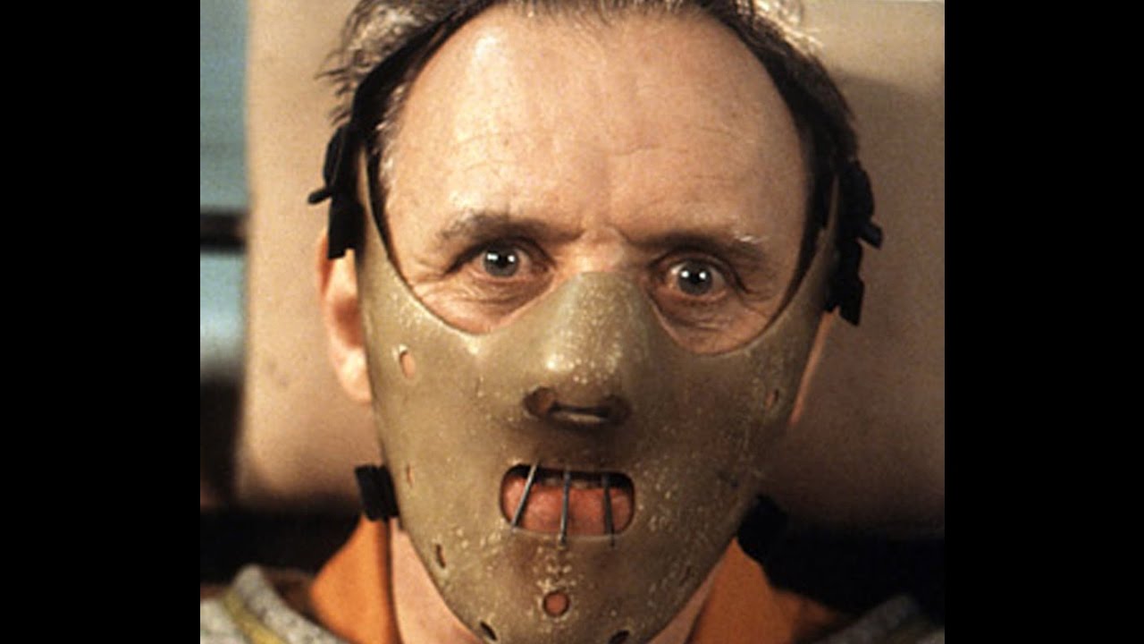 Anthony Hopkins as Hannibal Lecter, wearing a face mask.